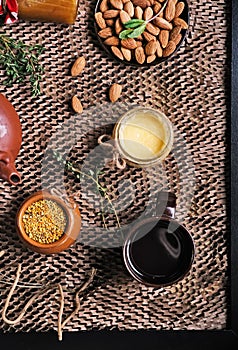 Flat lay still life with honey and nuts in black frame