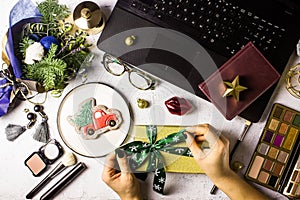 Flat lay styled office desk with laptop, winter bouquet with Nob