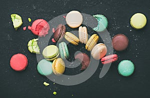 Flat-lay of sweet colorful French macaroon cookies variety photo