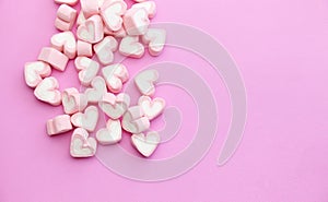 Flat lay template design top view pink marshmallows on sweet background with copy space