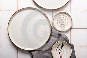 Flat lay textured ripple empty grey ceramic plate with napkin