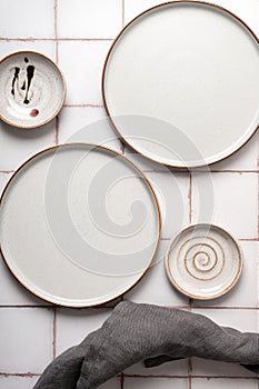Flat lay textured ripple empty grey ceramic plate with napkin
