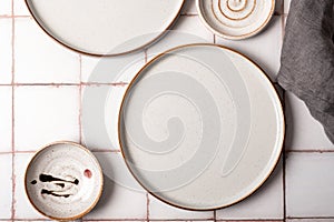 Flat lay textured ripple empty grey ceramic plate with napkin