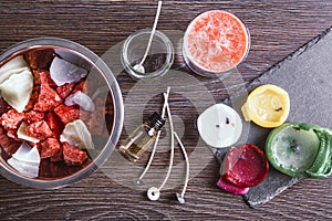 Flat lay of tools for reusing old candles leftovers and making melting a new one.