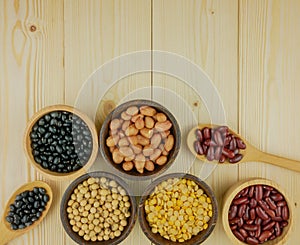 Flat lay,top view assorted beans on wooden background