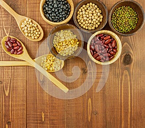 Flat lay,top view assorted beans on wooden background