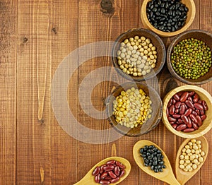 Flat lay,top view assorted beans on wooden background