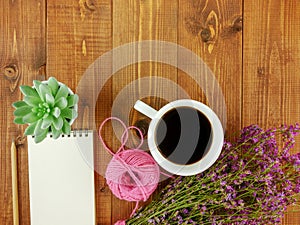 Flat lay,top view brown wooden desk with stationery  and coffee