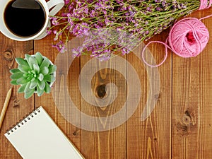 Flat lay,top view brown wooden desk with stationery  and coffee