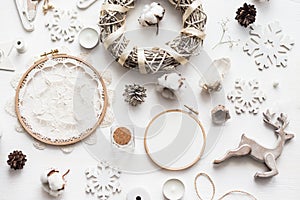 Flat lay top view Christmas photo with an embroidery hoop and cute decoration.