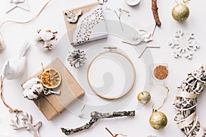 Flat lay top view Christmas photo with an embroidery hoop and cute decoration.