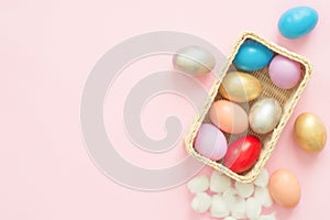 Flat lay top view colorful easter egg painted in pastel colors composition on pink pastel color background.