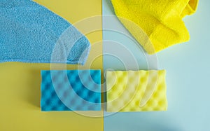 Flat lay, top view. Detergents and cleaners yellow and blue. The concept of cleaning