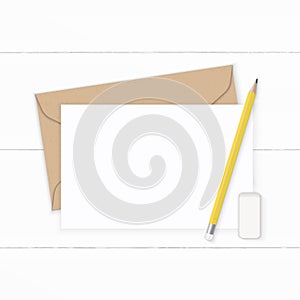 Flat lay top view elegant white composition letter kraft paper envelope yellow pencil and eraser on wooden background