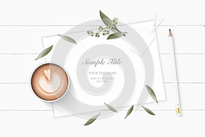 Flat lay top view elegant white composition paper botanic garden plant leaf flower pine cone tag pencil and coffee on wooden