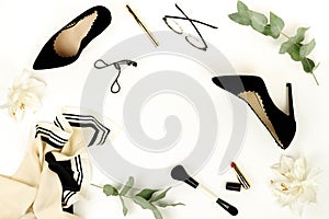 Flat lay, top view female black high heels shoes, accessories and make up cosmetics