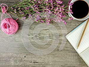 Flat lay,top view grey wooden desk with stationery  and coffee