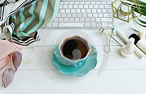 Flat lay, top view office feminine desk, female make up accessories, workspace with laptop, cup of coffee .Beauty blog concept