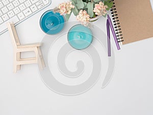 Flat lay, top view office table desk frame. feminine desk workspace with laptop, watch on white background.Love concept top view