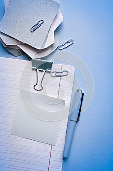 Flat lay, top view office table desk.Minmal workspace. Overhead of office table.Business desk on blue.