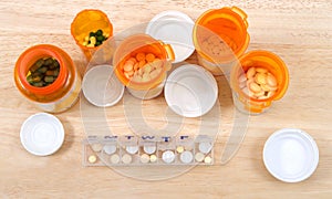 Flat lay top view of pill bottles and once daily med box