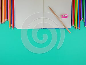 Flat lay,top view stationery on green background