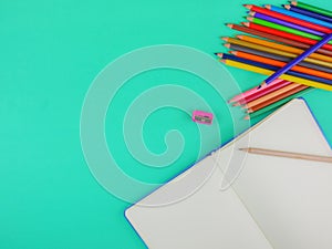 Flat lay,top view stationery on green background