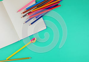 Flat lay,top view stationery on green background