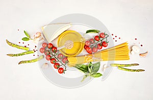 Flat lay with traditional italian pasta spaghetti and cooking ingredients. Traditional italian cusine concept.