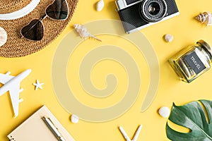 Flat lay travel accessories on yellow background. Travel, summer vacation concept. Copy space for text, top view