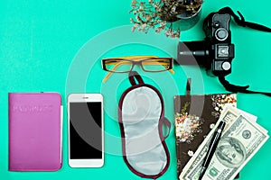 Flat lay travel concept with camera ,smart phone and bank note o