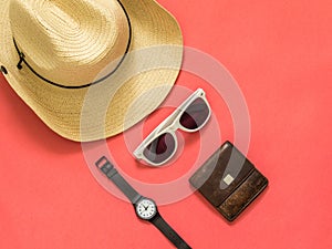 Flat lay traveler accessories on pink background with blank space for text. Top view travel or vacation concept. Summer