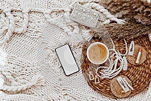 Flat lay trendy feminine accessories with coffee cup, phone.