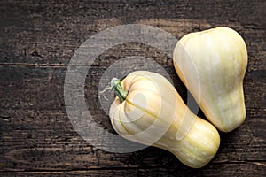 Flat lay, two butternut squash on wooden table