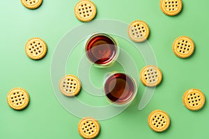 Flat lay of two cups of tea and cookies