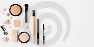 Makeup Products Arranged on a White Surface