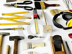 Flat lay of various technician tools isolated on white background