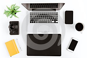 Flat lay with various wireless devices and coffee cup