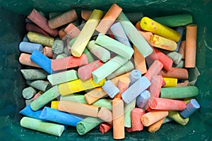 Flat lay view of Coloured chalks in a box