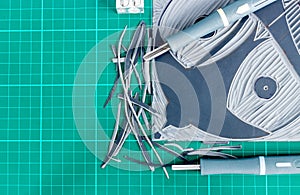 Flat lay view of lino cutting tools