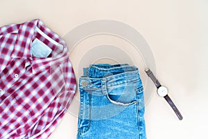 Flat lay of woman clothes and accessories set with glasses. Trendy fashion female background.