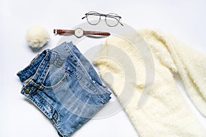 Flat lay of woman clothes and accessories set with glasses, watch.