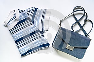 Flat lay of woman clothes and accessories set with handbag.