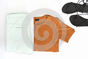 Flat lay of woman clothes and accessories set with shoes.