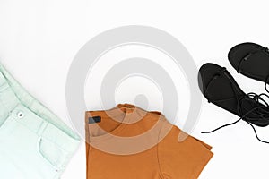 Flat lay of woman clothes and accessories set with shoes.