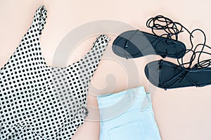 Flat lay of woman clothes and accessories set with shoes.