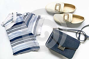 Flat lay of woman clothes and accessories set with shoes, handbag. Trendy fashion female background.