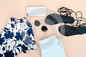 Flat lay of woman clothes and accessories set with shoes, watch.