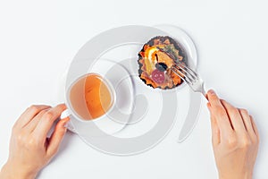 Flat lay woman's hands holding cup herbal tea