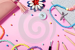 Flat lay of woman`s lifestyle, accessories and cosmetics with pink background